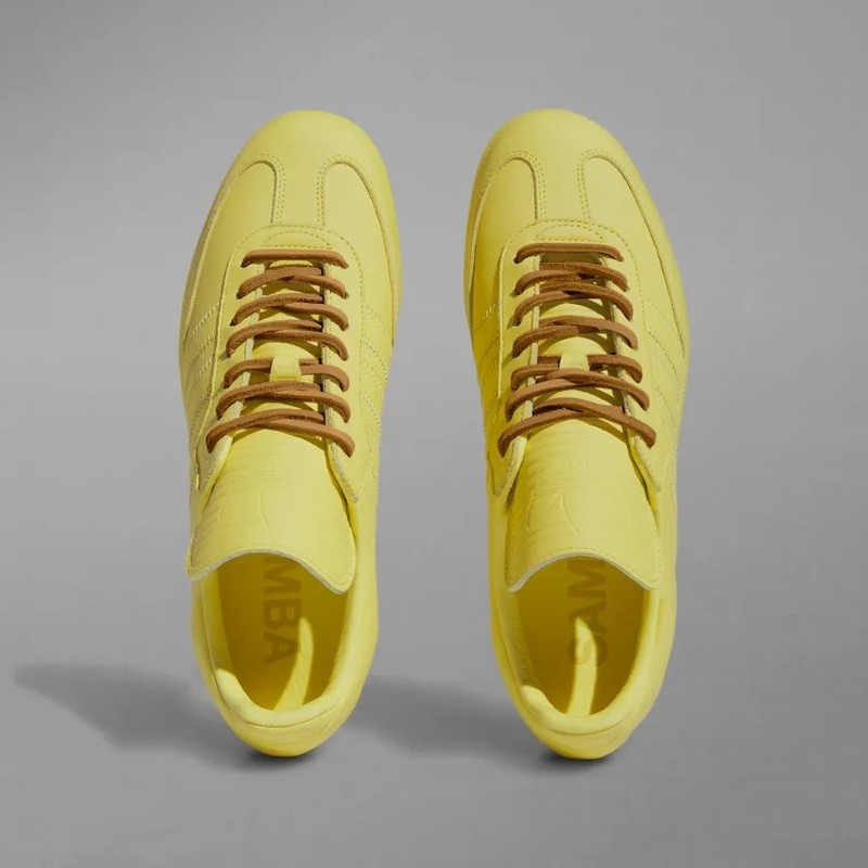 Human race sales yellow sneakers